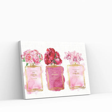 Three Perfume Bottles In Pink Canvas Wall Art - Y Canvas